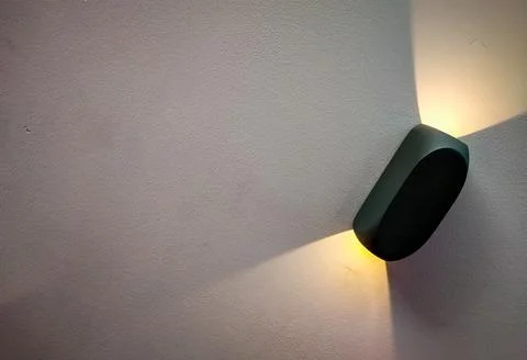 Two sided wall light with yellow light 스톡 사진