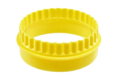 Two sided yellow round cookie cutter, cut out 스톡 사진