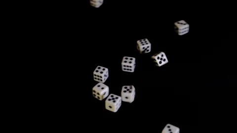 From two sides white cubes fly out on a black background. The dice rotate and Stock Footage 129872799