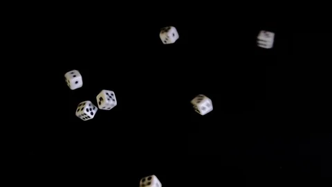 From two sides white cubes fly out on a black background. The dice rotate and Stock Footage 129872826