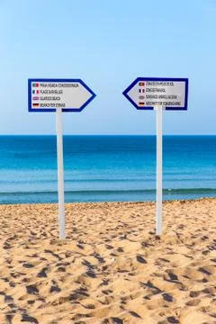 Two signposts standing on sandy beach Foto stock