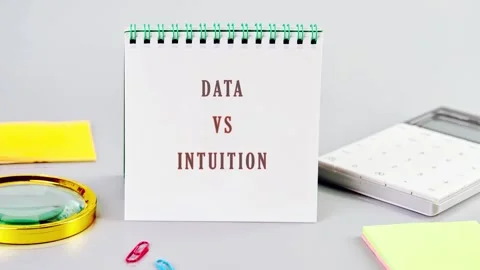 Two signs display the words data and intuition in a simple setting with Stock Footage 340778385
