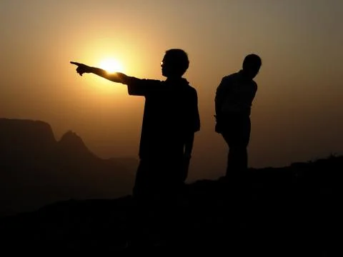 Two Silhouette in Sunset Stock Photos