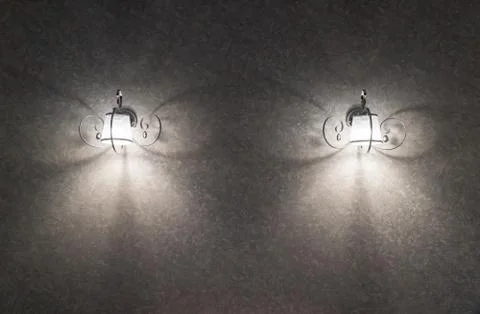 Two silver lamp have gray wall is background for interior design. The lights Stock Photos