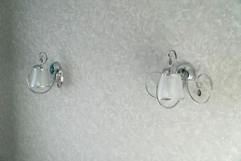 Two silver lamp have light gray wall is background for interior design. The l Stock Photos