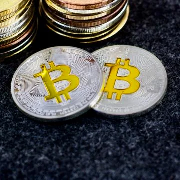 Two silver physical bitcoins Stock Photos