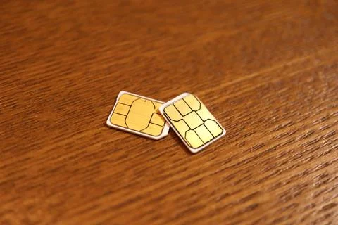 Two SIM cards for mobile cellular phones and telecommunication devices with.. Stock Photos