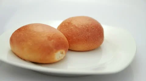 Two simple bread rotating Video stock 10819974