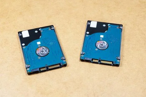 Two simple identical HDD hard drives, objects closeup, nobody. Digital data Stock Photos