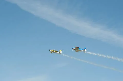 Two single-engine biplane aircraft to fly in the sky Stock Photos