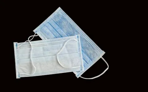 Two Single use hygenic face mask on black background Stock-Fotos