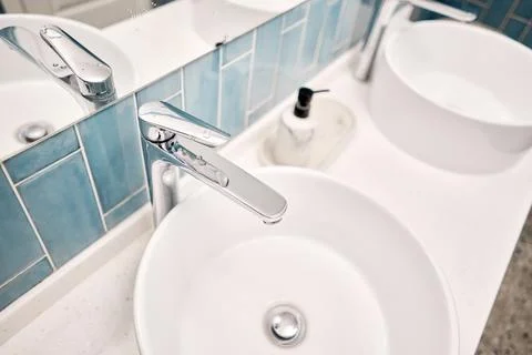 Two sinks in the bathroom sink next to stylish decorations. A beautiful sink Stock Photos