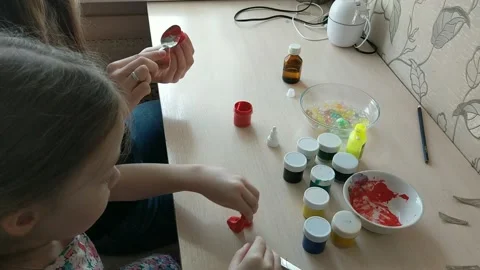 Two sisters are engaged in manual work, creating some figures for toys. Kindness Video stock 151605019