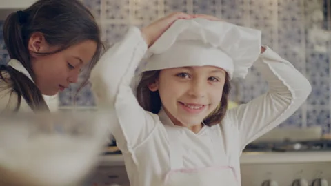 Two sisters cooking in the kitchen Stock Footage 279741187