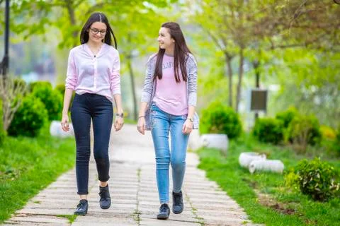Two sisters having fun in the park Stock Photos