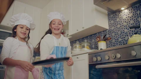 Two sisters making something in the kitchen Stock Footage 279737055