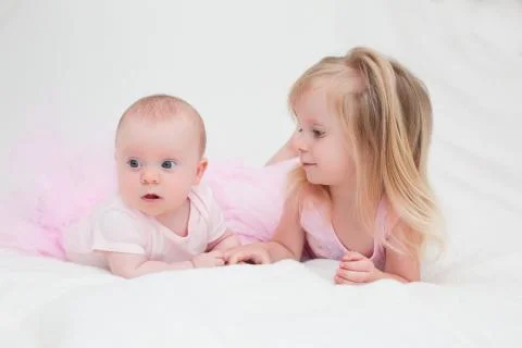 Two Sisters, One Cute 3 Years Old Toddler Girl and 4 Month Old Cute Baby Girl, I Stock Photos