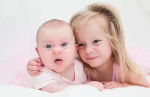 Two Sisters, One Cute 3 Years Old Toddler Girl and 4 Month Old Cute Baby Girl, I Stock Photos