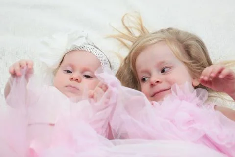 Two Sisters, One Cute 3 Years Old Toddler Girl and 4 Month Old Cute Baby Girl, I Stock Photos