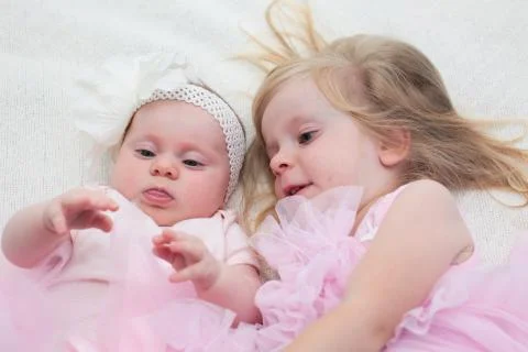 Two Sisters, One Cute 3 Years Old Toddler Girl and 4 Month Old Cute Baby Girl, I Stock Photos