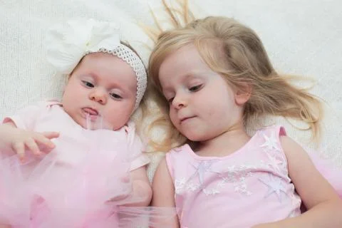 Two Sisters, One Cute 3 Years Old Toddler Girl and 4 Month Old Cute Baby Girl, I Stock Photos