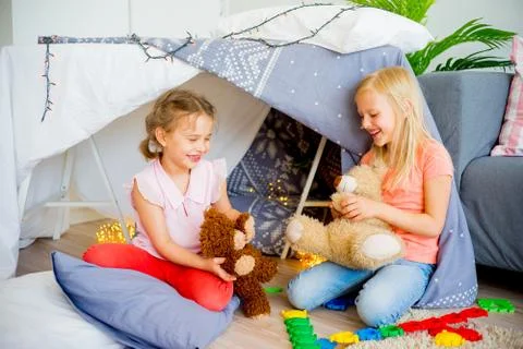 Two sisters in a play tent Stock Photos