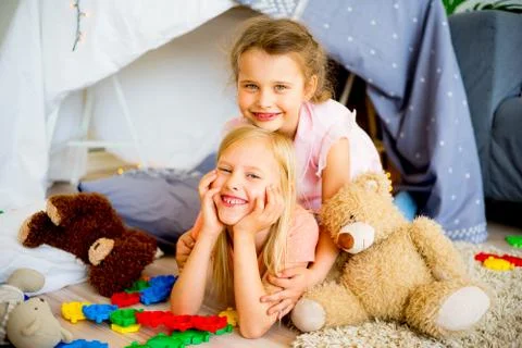 Two sisters in a play tent Stock Photos