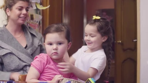 Two sisters playing in the kitchen Video stock 76934020