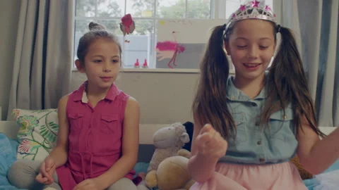 Two sisters playing in the their room Stock Footage 279730881
