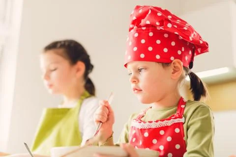Two sisters preparing granola together Stock Photos