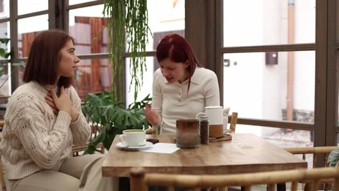 Two sisters sitting in a cafe  Stock Footage 320827324