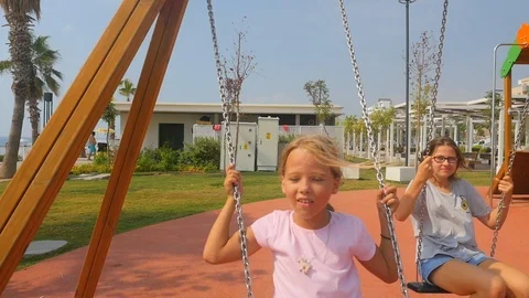 Two sisters swinging Stock Footage 123164581