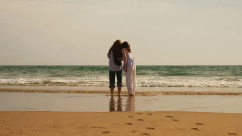 Two Sisters Walking and Having Fun on a Sunny Beach Stock-Footage 336720223