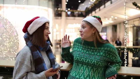 Two sisters warmly talk during Christmas time Stock Footage 325034429
