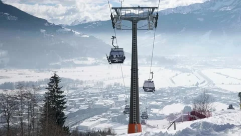 Two ski lifts passing each other Stock Footage 231550626