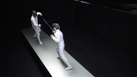 Two Skilled Male Fencers Engaging in Competitive Duel with Precision and Speed Stock Footage 218479727