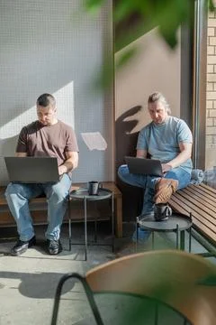 Two skilled professionals devops engaged in collaborative efforts within a Stock Photos