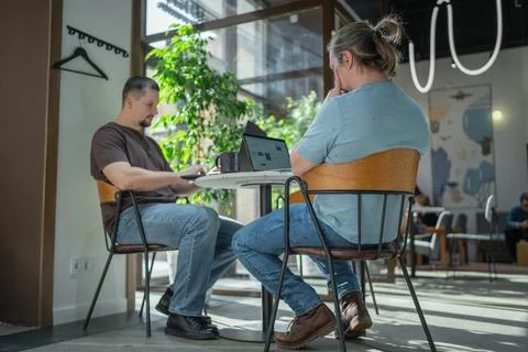 Two skilled professionals devops engaged in collaborative efforts within a Stock Photos