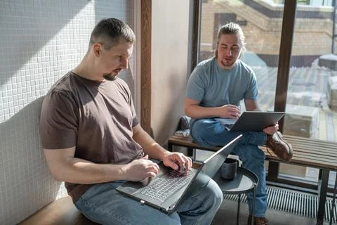 Two skilled professionals devops engaged in collaborative efforts within a Stock Photos