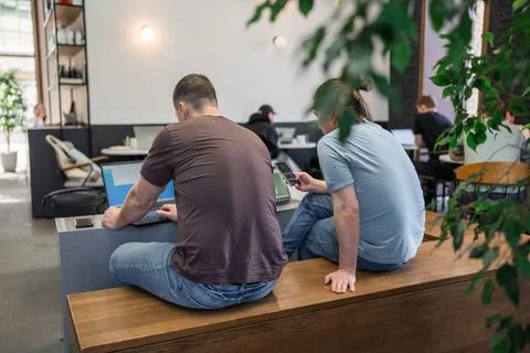 Two skilled professionals devops engaged in collaborative efforts within a Stock Photos