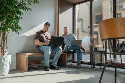 Two skilled professionals devops engaged in collaborative efforts within a Stock Photos