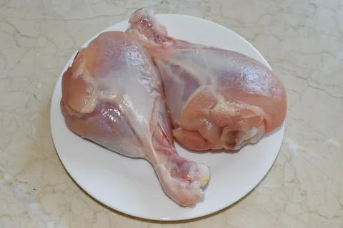 Two skinless chicken legs Stock Photos