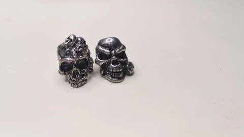 Two skulls on a white background. Stock Photos