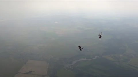 Two skydivers are in the cloudy sky. Video stock 111222162