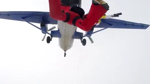 Two skydivers are jumping out of a plane Stockbeeldmateriaal 76670506
