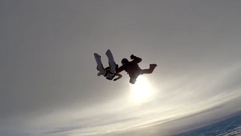 Two skydivers are training in the winter sky 스톡 동영상 76622218