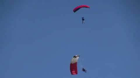 Two skydivers parachuting, air show, skydiving, extreme sport Stockbeeldmateriaal 40494203