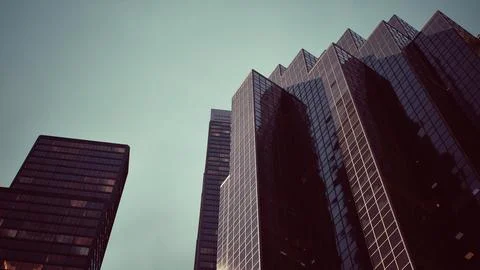 Two skyscrapers standing side by side in a modern cityscape イラスト素材