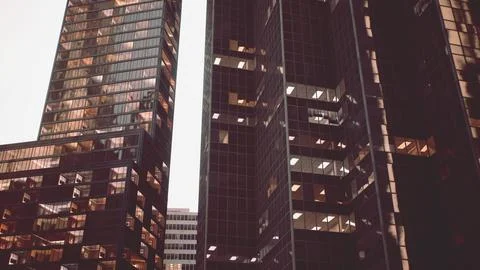 Two skyscrapers standing side by side in a modern cityscape イラスト素材