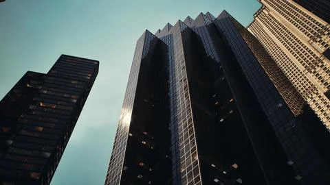 Two skyscrapers towering over a bustling cityscape Ilustração Stock